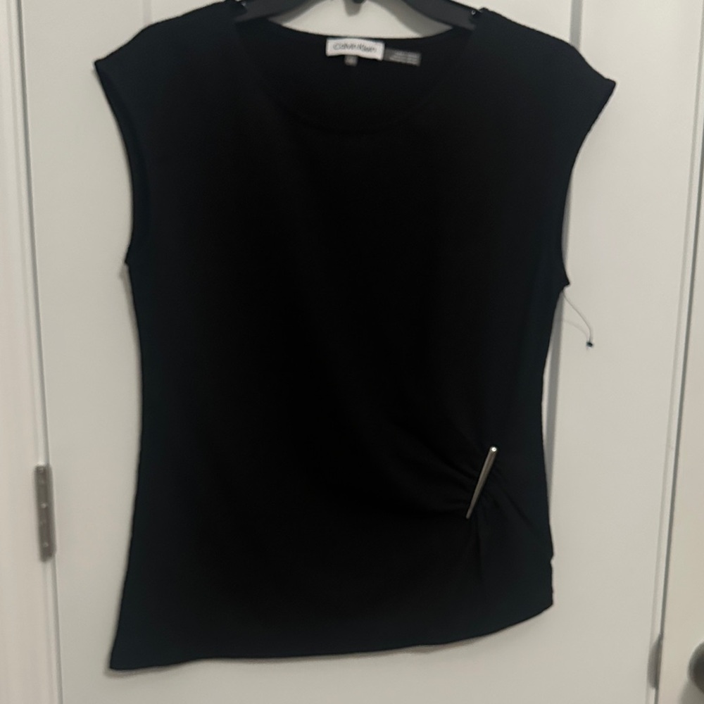Never worn!
Calvin Klein Black Women's Blouse with Pin Detail